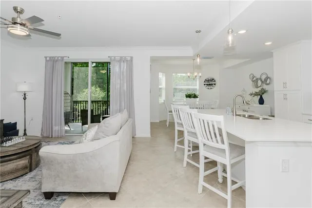 a living room with furniture and a chair