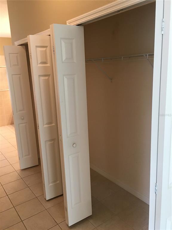 18047 Java Isle Drive Tampa, FL 33647 - Photo 9 of 21 a bathroom with a shower and a tub