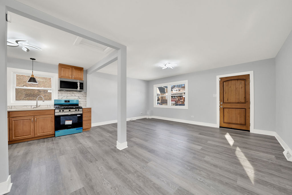 1275 West 71st Street Chicago, IL 60636 - Photo 11 of 21 a view of kitchen with sink and wooden floor