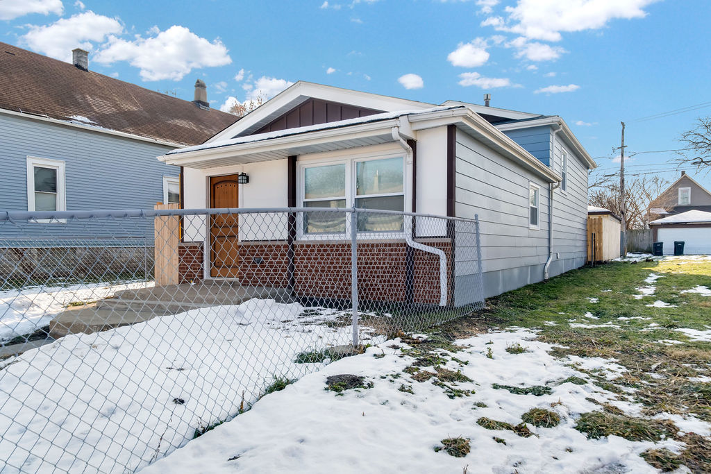 1275 West 71st Street Chicago, IL 60636 - Photo 3 of 21 a view of a house with a yard