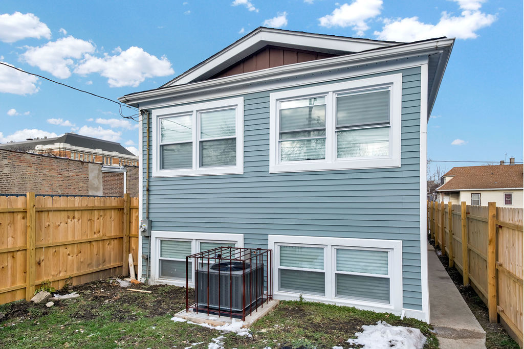 1275 West 71st Street Chicago, IL 60636 - Photo 4 of 21 a front view of a house with a yard