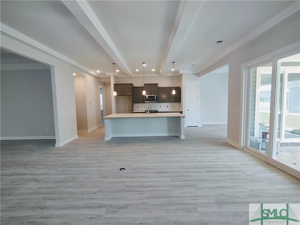 134 Bramswell Road Pooler, GA 31322 - Photo 4 of 30 GREAT ROOM WITH TRAY CEILING, FLOOR PLUG, LVP THRO