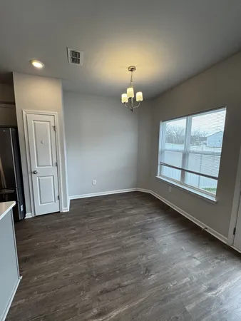 a kitchen with stainless steel appliances granite countertop a refrigerator a sink a stove a microwave and cabinets