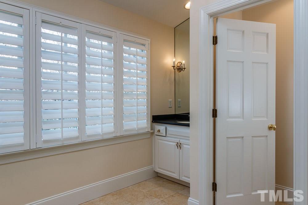 308 Buncombe Street Raleigh, NC 27609 - Photo 11 of 25 a view of kitchen with white cabinets and a window