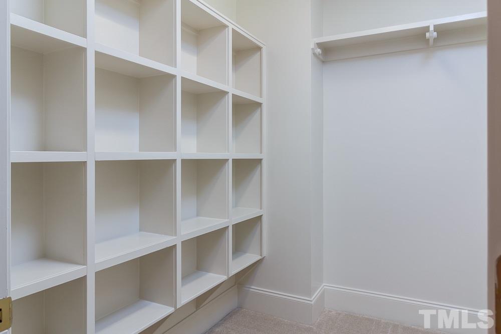 308 Buncombe Street Raleigh, NC 27609 - Photo 14 of 25 a view of walk in closet with empty racks