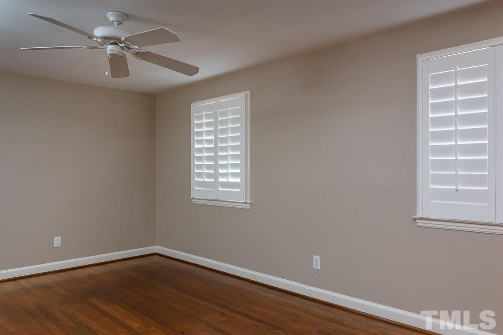 308 Buncombe Street Raleigh, NC 27609 - Photo 18 of 25 a view of a room with a window and wooden floor