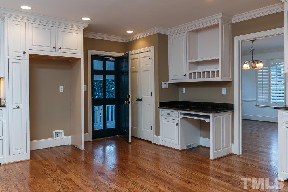 308 Buncombe Street Raleigh, NC 27609 - Photo 8 of 25 a kitchen with stainless steel appliances granite countertop a refrigerator and a stove top oven