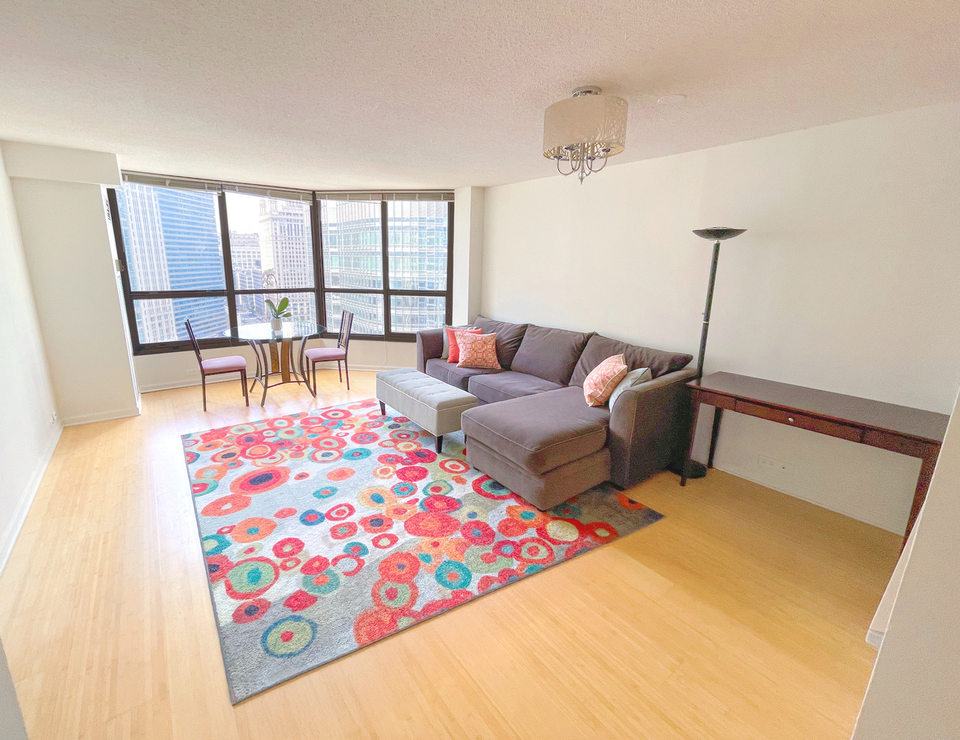 405 North Wabash Avenue, Unit 1410 Chicago, IL 60611 - Photo 5 of 18 a living room with furniture and a large window