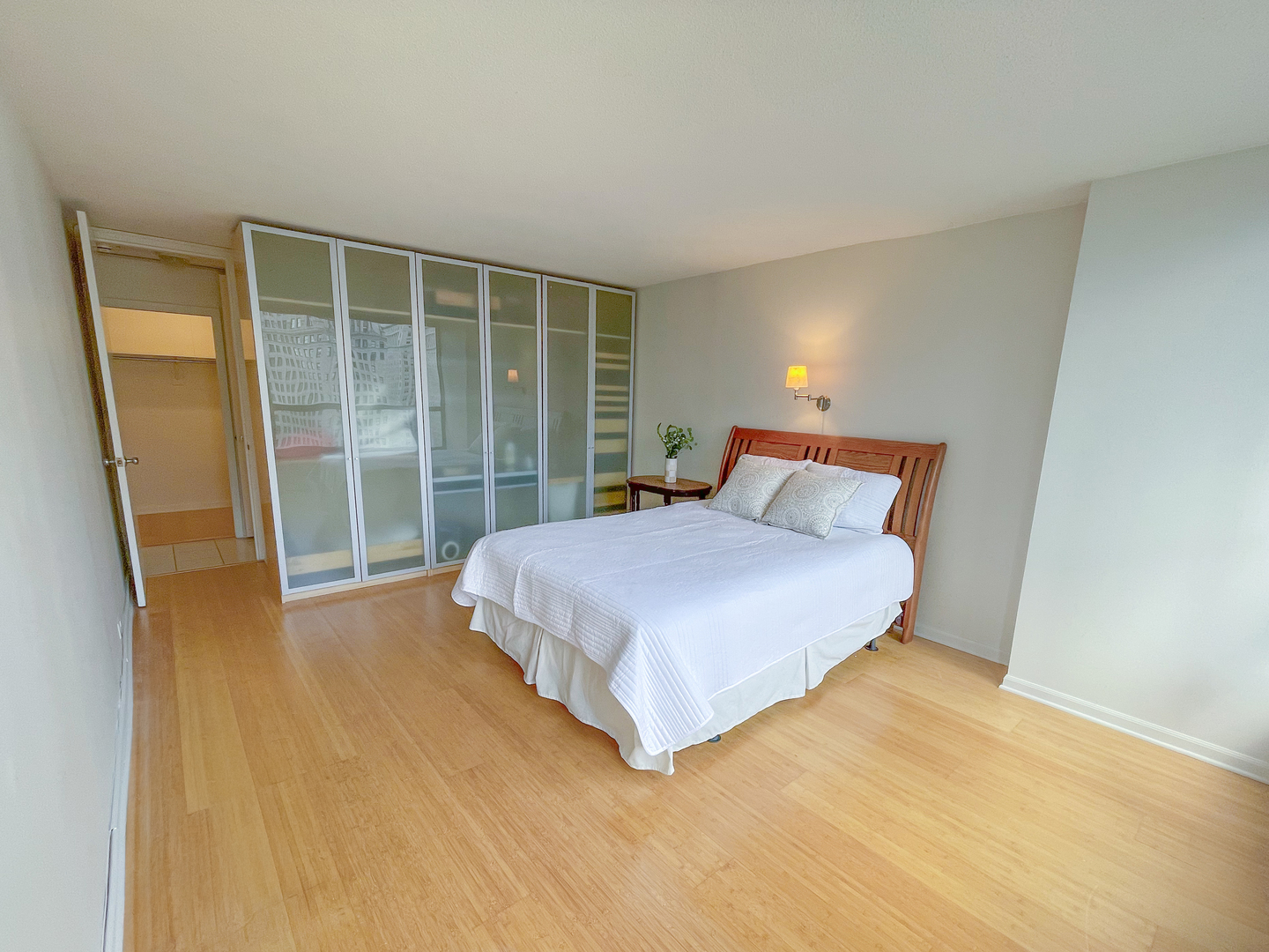 405 North Wabash Avenue, Unit 1410 Chicago, IL 60611 - Photo 9 of 18 a bedroom with a bed and a large window
