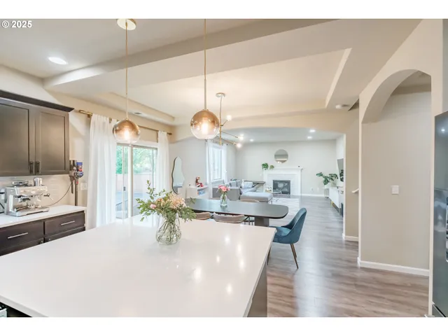 a kitchen with a table and chairs in it