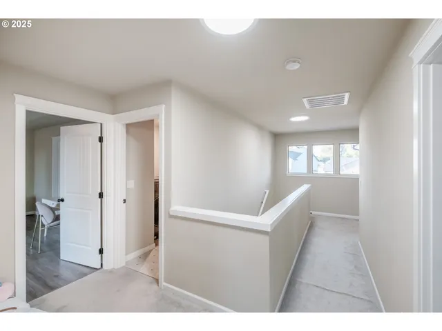 a bedroom with a bed and a mirror