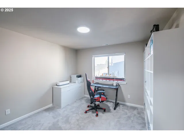 a bedroom with furniture and a book shelf