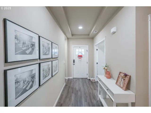 a open hall with furniture and wooden floor
