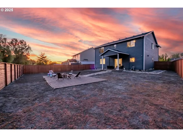 a front view of house with a garden