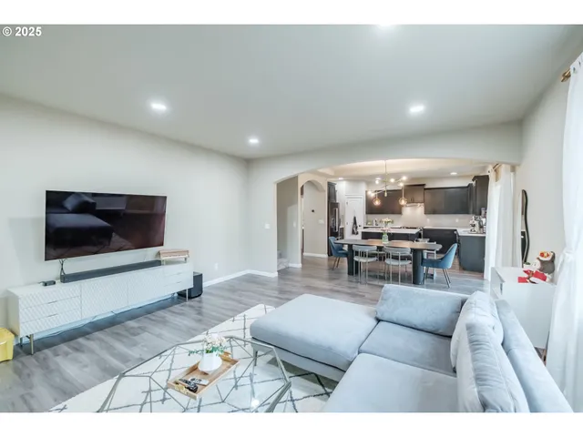 a kitchen with stainless steel appliances a sink stove and refrigerator
