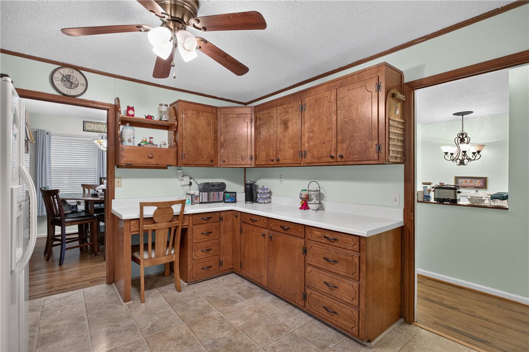 104 Laurel Lane Seneca, SC 29678 - Photo 10 of 36 Functional kitchen with ample cabinet space and a convenient built-in desk area.