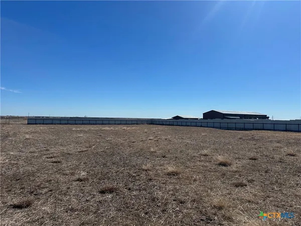 a view of an ocean beach and mountain