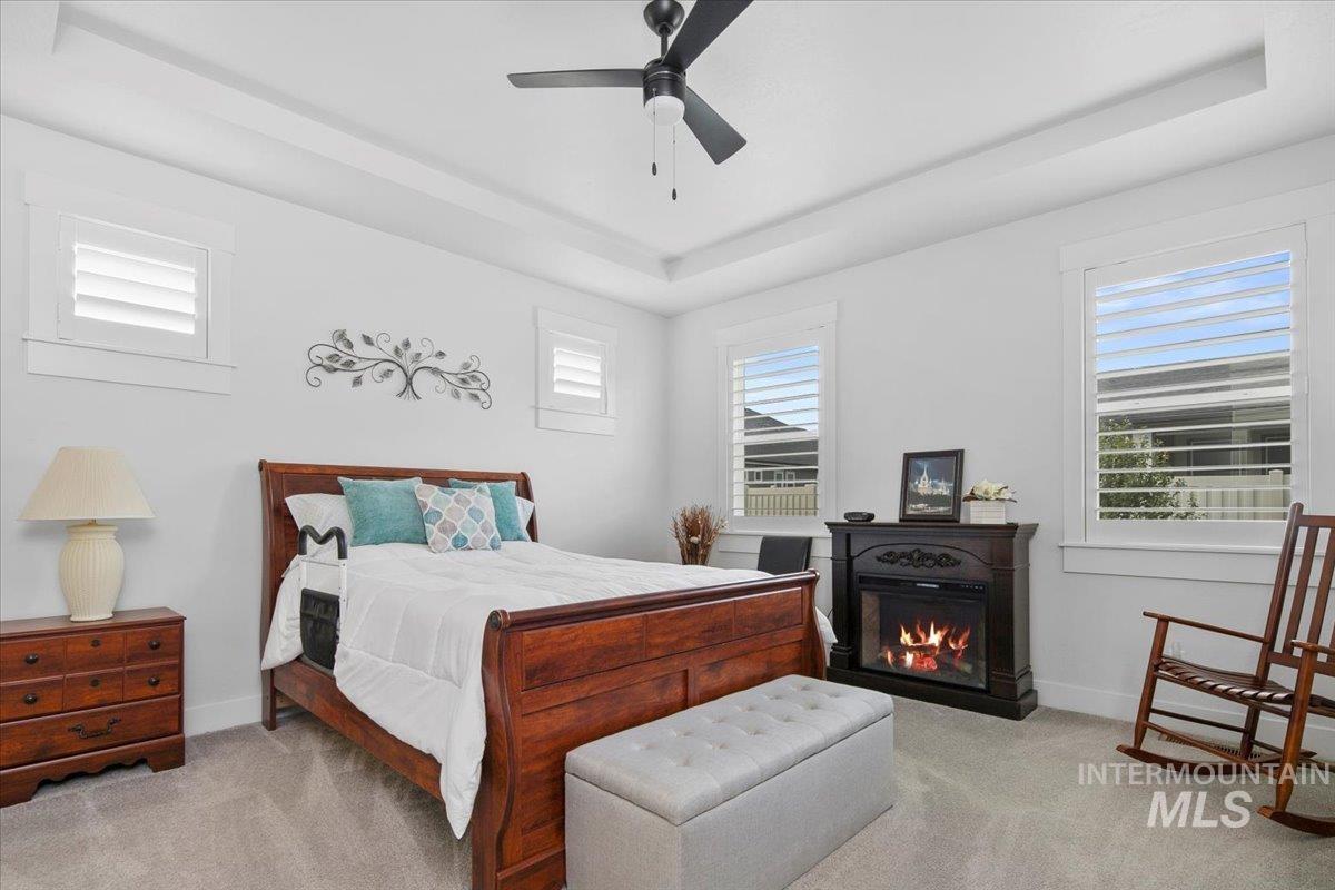 1685 Shoal Point Avenue Middleton, ID 83644 - Photo 25 of 44 Bedroom featuring a raised ceiling, carpet, and a ceiling fan