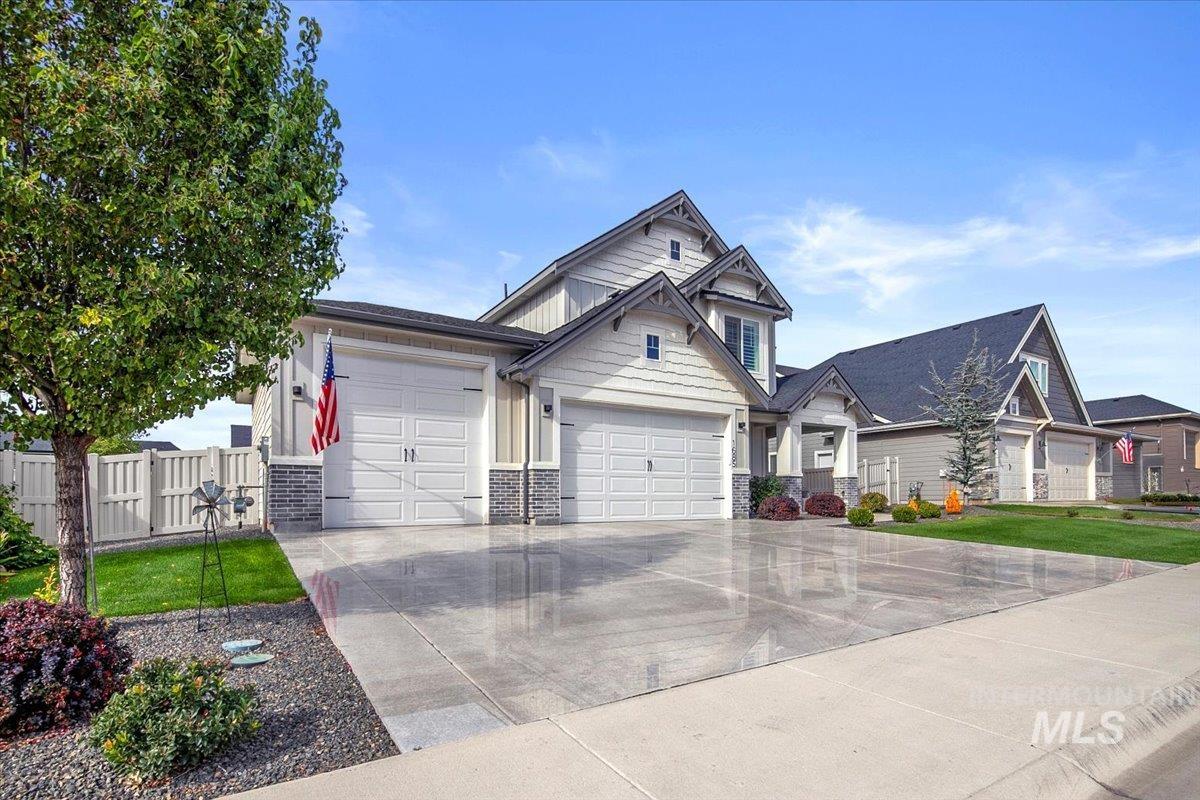 1685 Shoal Point Avenue Middleton, ID 83644 - Photo 3 of 44 Craftsman house with an attached garage, driveway, and stone siding