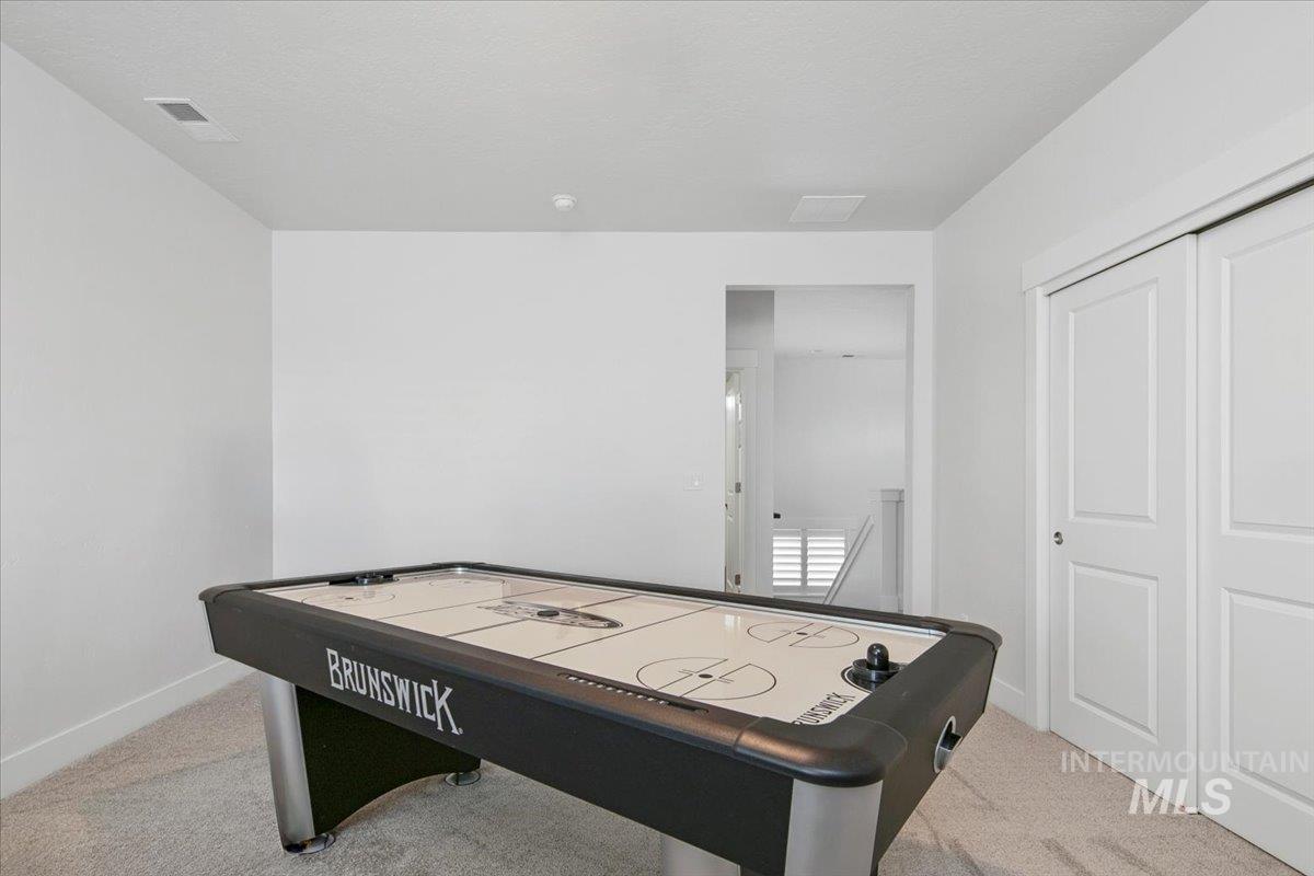 1685 Shoal Point Avenue Middleton, ID 83644 - Photo 35 of 44 Game room with light carpet and baseboards