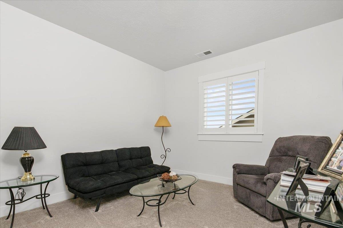 1685 Shoal Point Avenue Middleton, ID 83644 - Photo 38 of 44 Living area featuring carpet flooring and baseboards