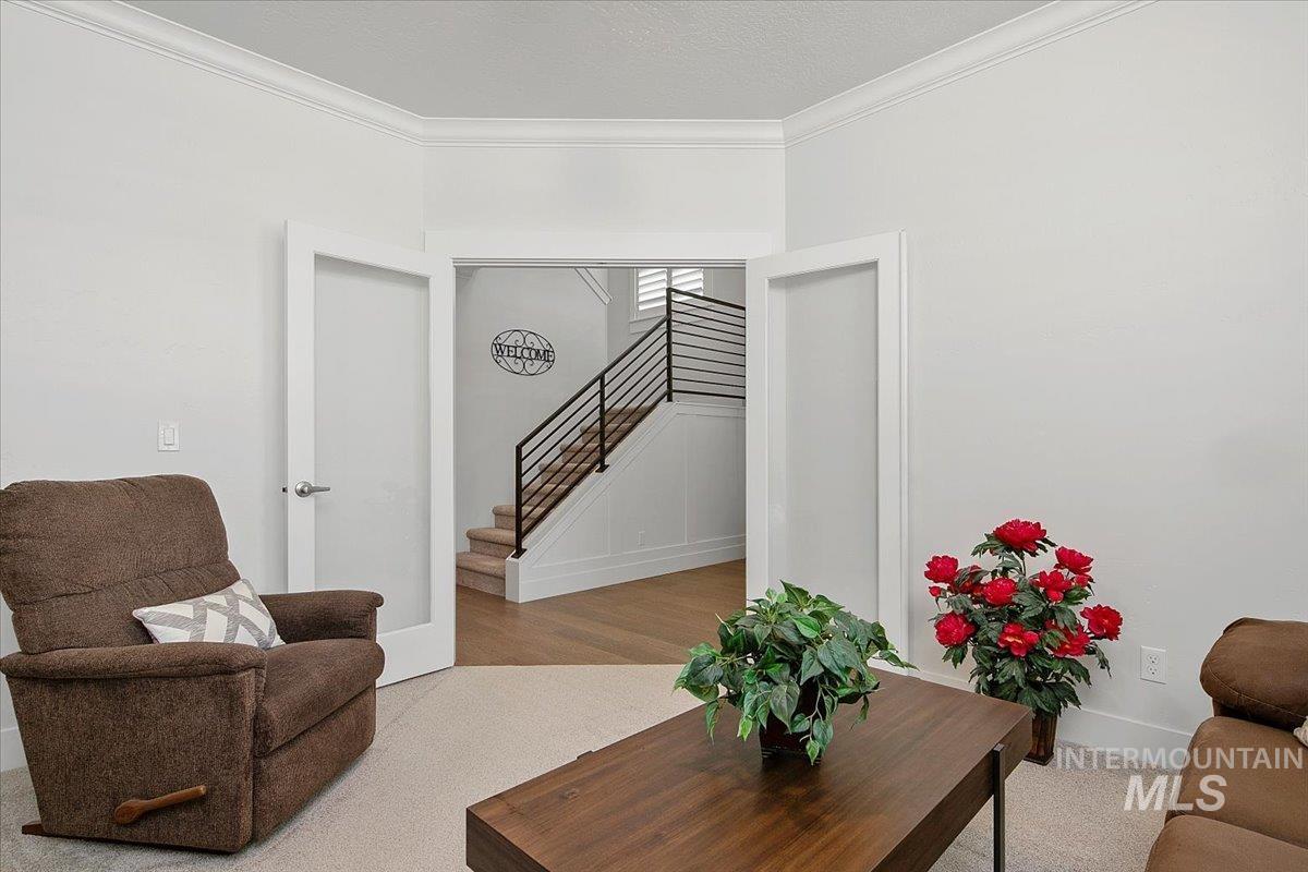 1685 Shoal Point Avenue Middleton, ID 83644 - Photo 6 of 44 Living room with crown molding and stairway