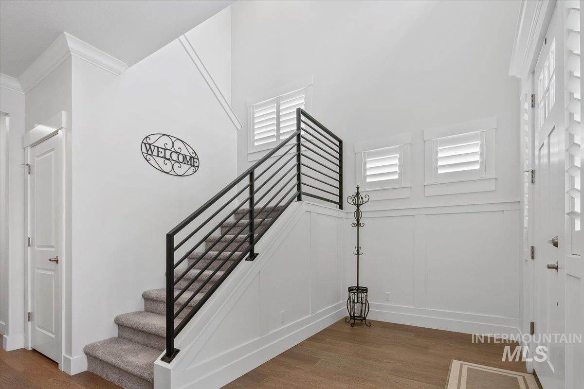 1685 Shoal Point Avenue Middleton, ID 83644 - Photo 7 of 44 Stairs featuring wood finished floors and ornamental molding