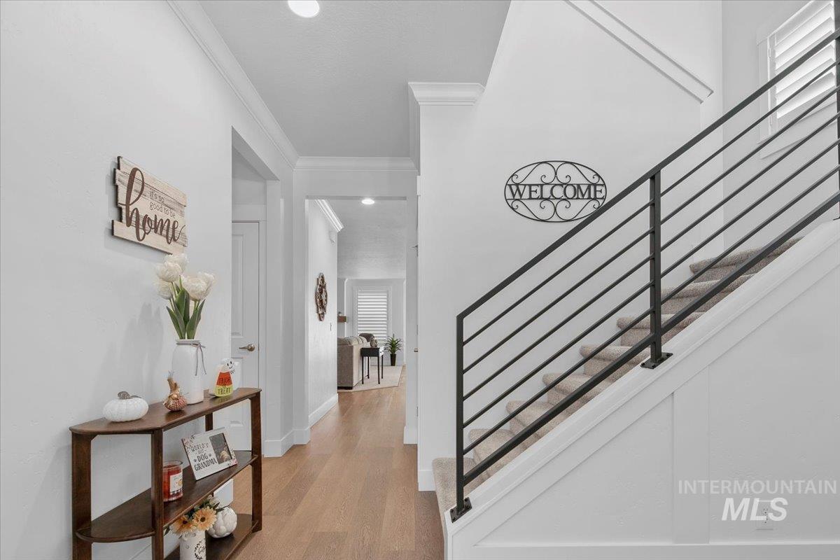 1685 Shoal Point Avenue Middleton, ID 83644 - Photo 8 of 44 Stairway featuring ornamental molding, wood finished floors, and recessed lighting