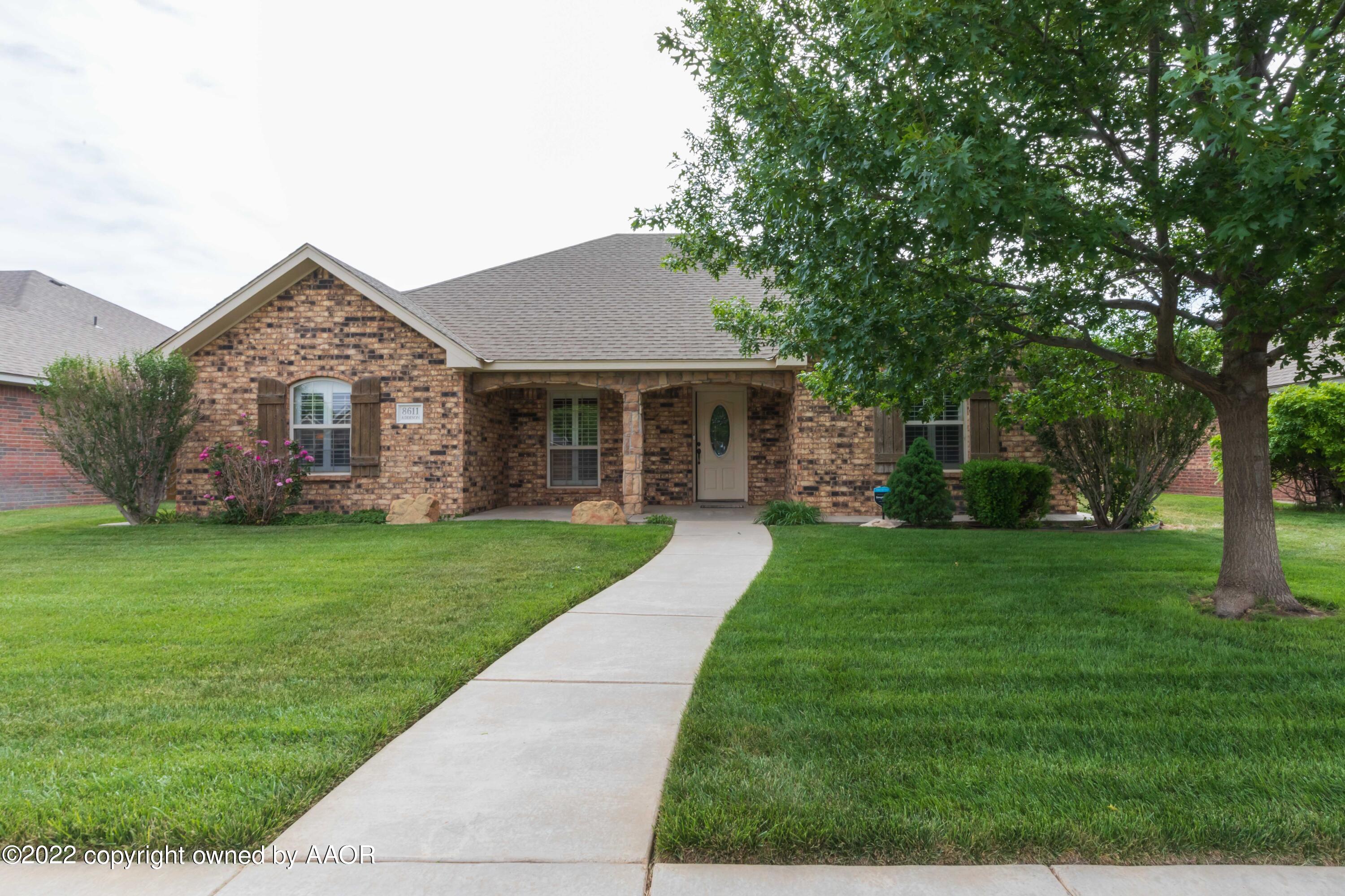 front view of a house with a yard