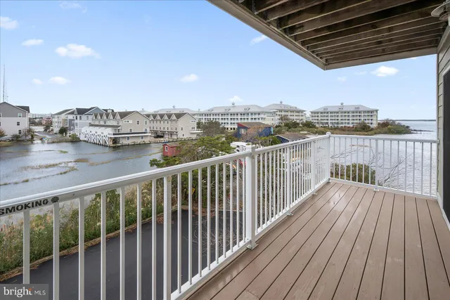 a view of a balcony with wooden floor