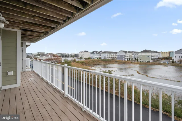 a view of a balcony with wooden floor and city view