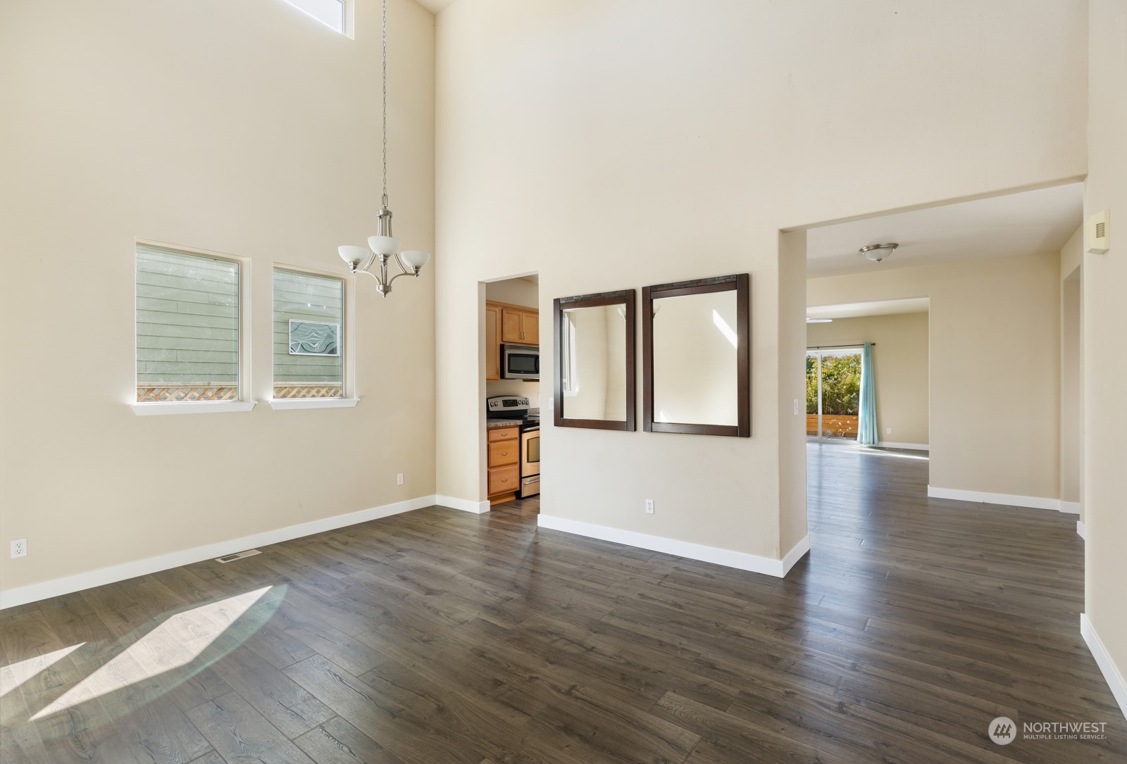 7365 Radius Loop Southeast Lacey, WA 98513 - Photo 12 of 24 a view of an empty room with wooden floor and a window