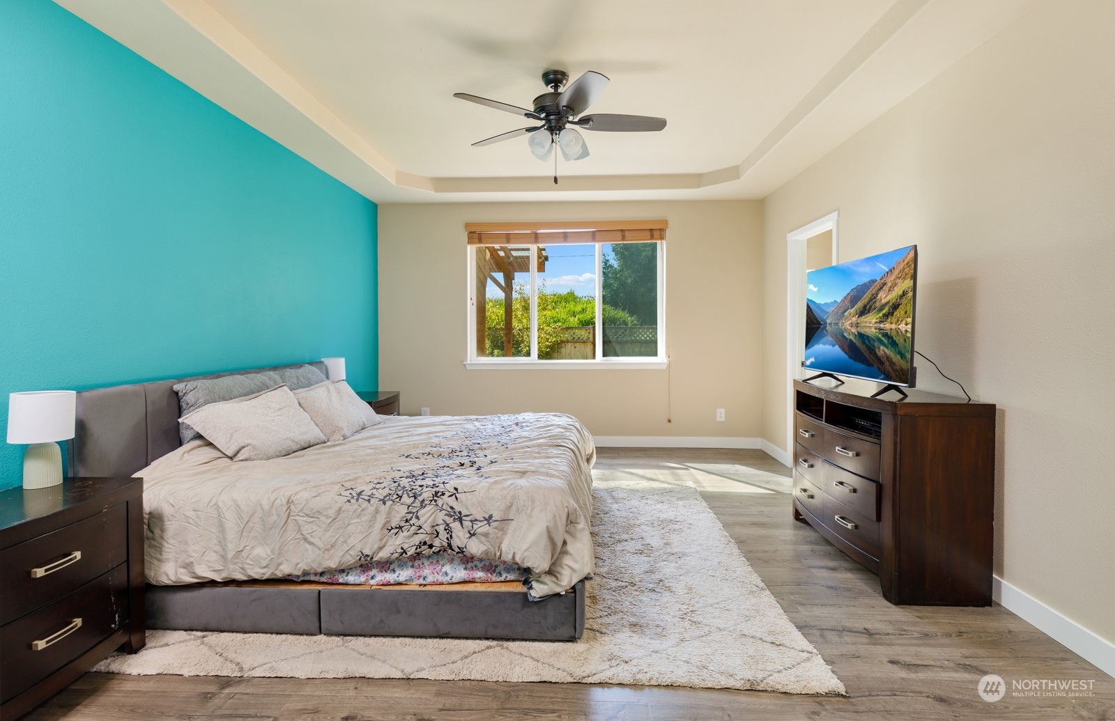 7365 Radius Loop Southeast Lacey, WA 98513 - Photo 17 of 24 a bedroom with a bed and a ceiling fan