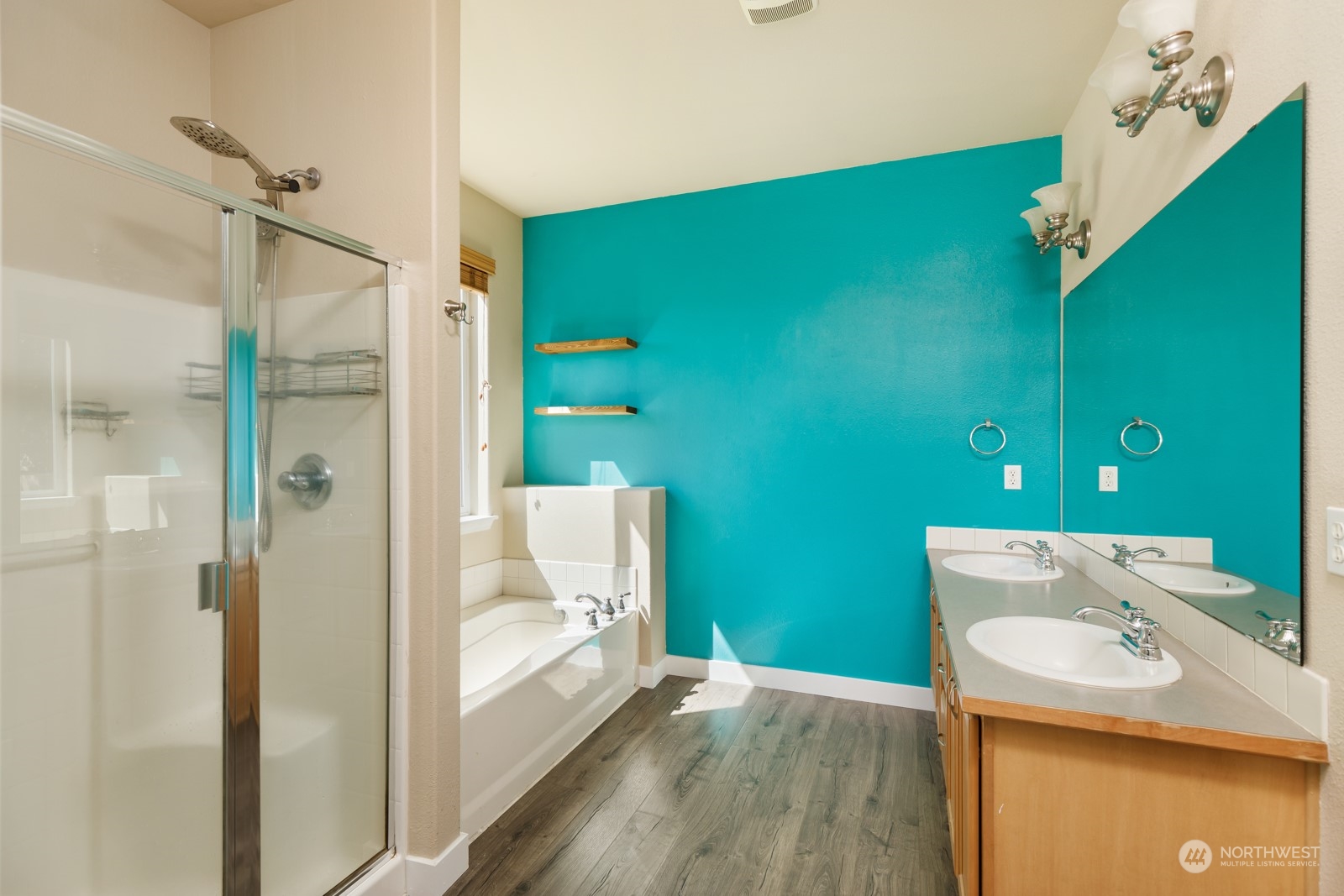 7365 Radius Loop Southeast Lacey, WA 98513 - Photo 19 of 24 a bathroom with a sink a toilet and shower