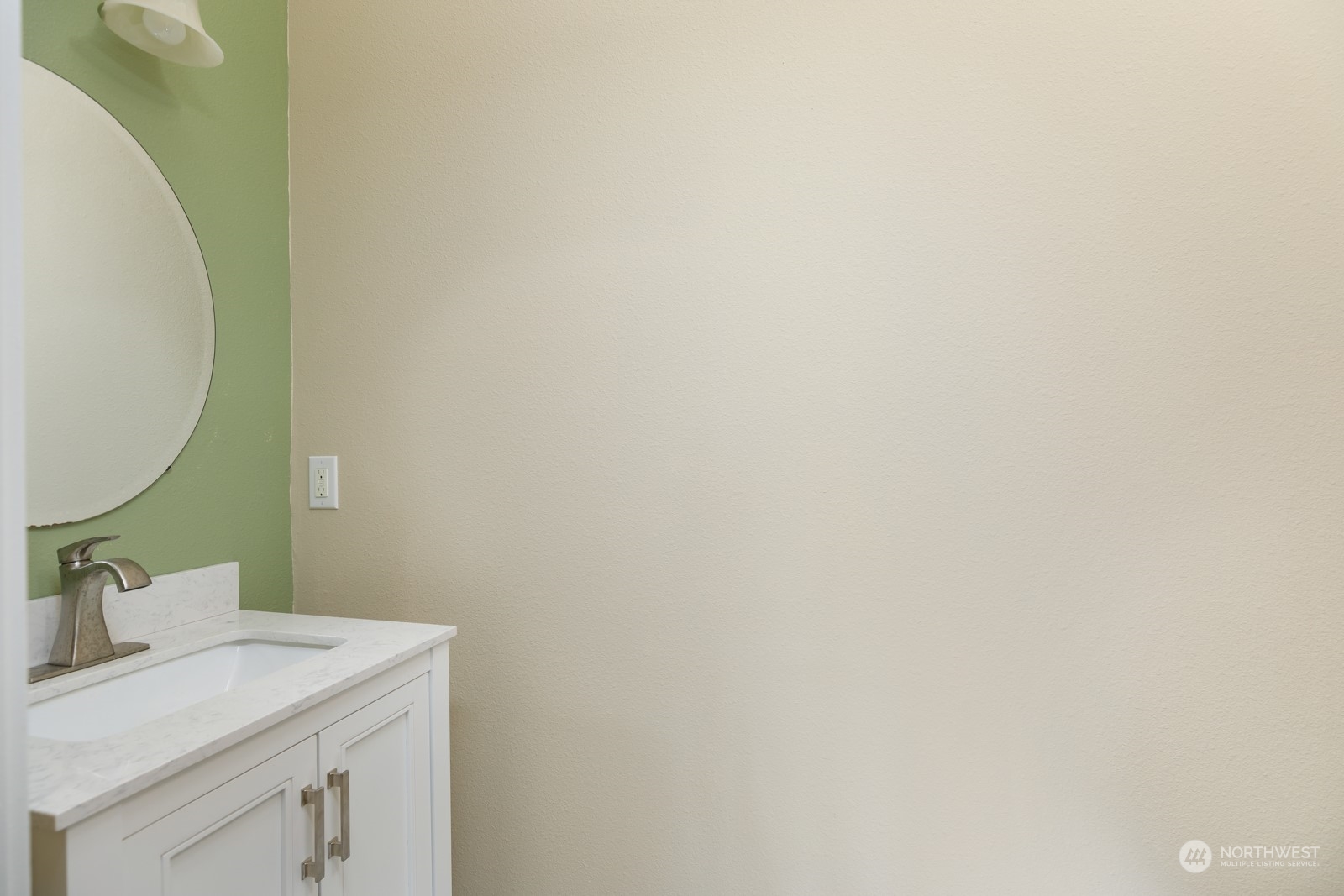 7365 Radius Loop Southeast Lacey, WA 98513 - Photo 20 of 24 a bathroom with a sink and a mirror