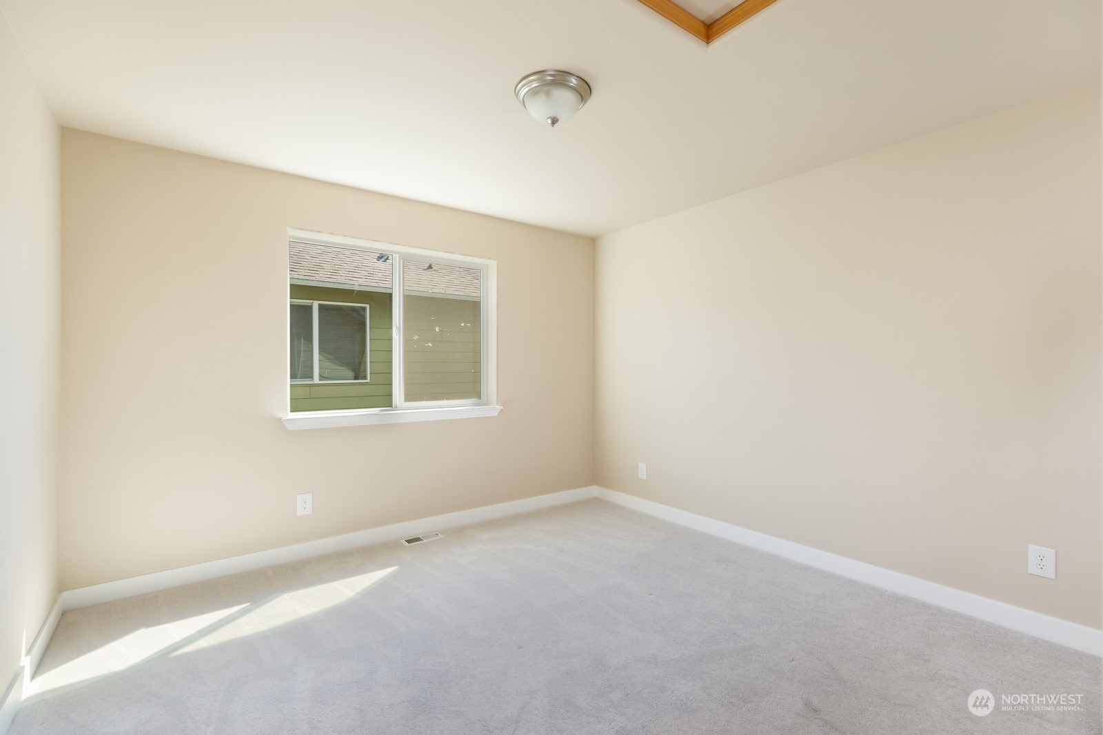 7365 Radius Loop Southeast Lacey, WA 98513 - Photo 21 of 24 a view of an empty room with a window