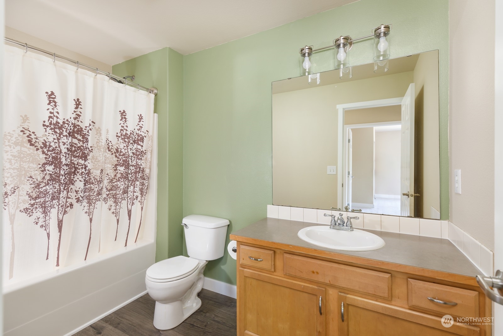 7365 Radius Loop Southeast Lacey, WA 98513 - Photo 22 of 24 a bathroom with a sink toilet and shower