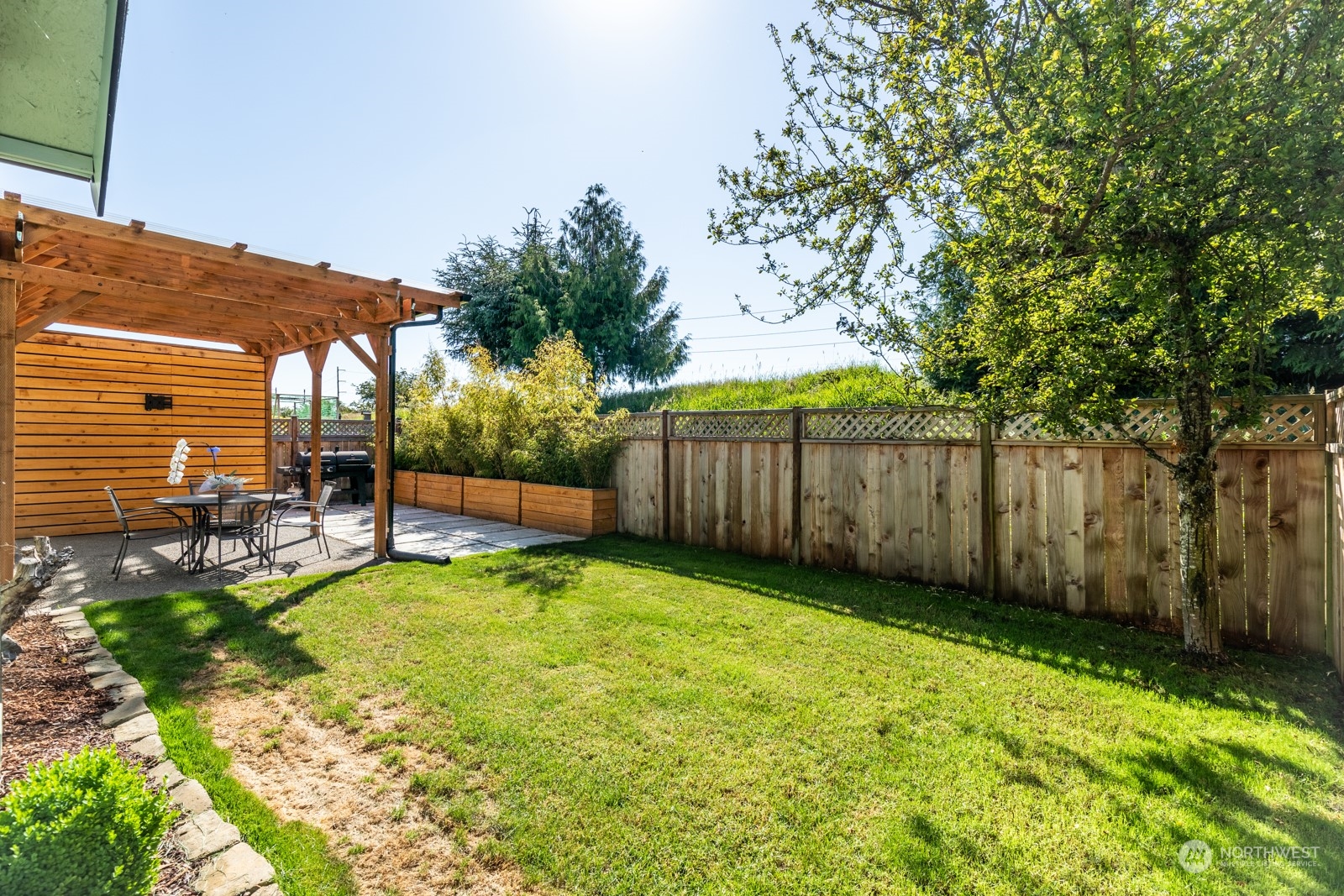 7365 Radius Loop Southeast Lacey, WA 98513 - Photo 3 of 24 a view of a backyard with a sitting area