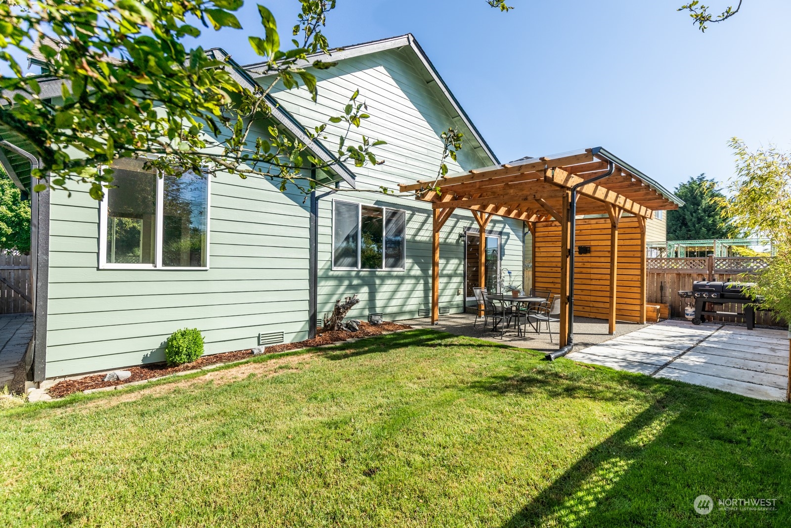 7365 Radius Loop Southeast Lacey, WA 98513 - Photo 4 of 24 a view of a house with backyard and sitting area