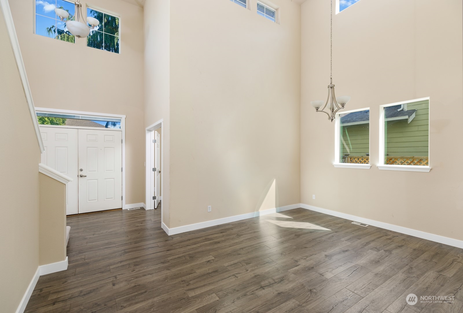 7365 Radius Loop Southeast Lacey, WA 98513 - Photo 5 of 24 a view of an empty room with wooden floor and a window