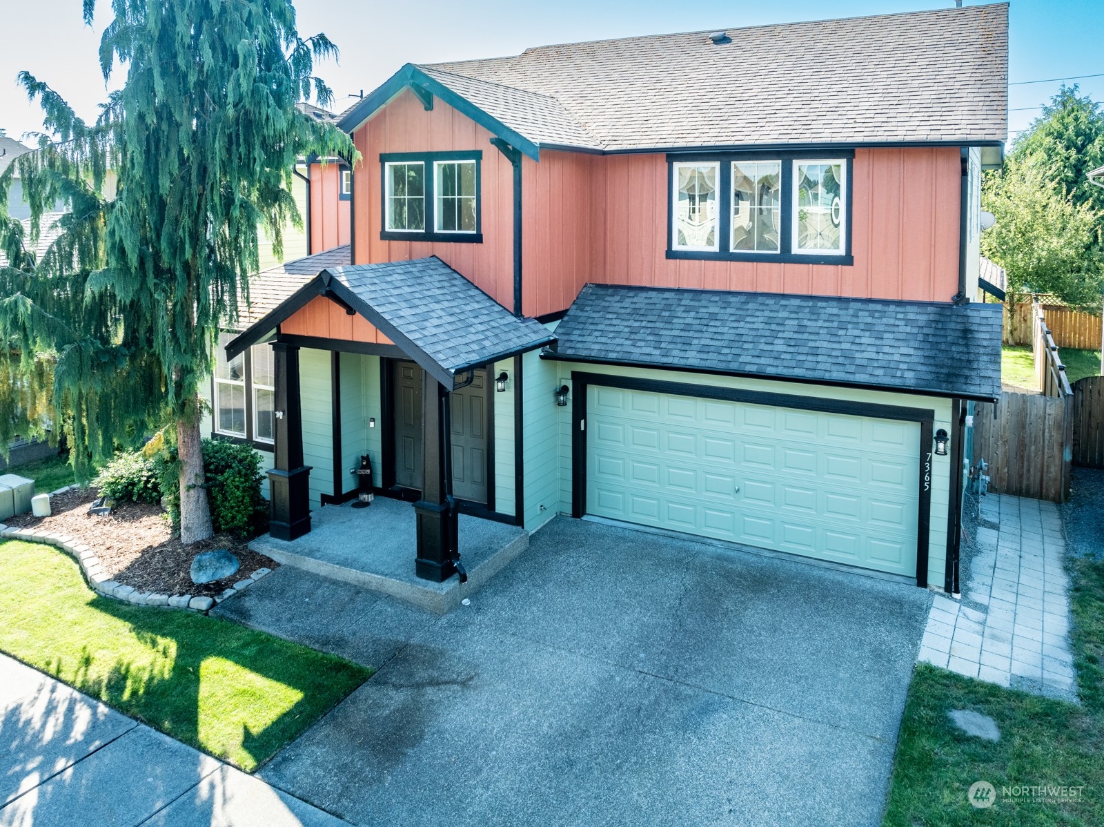7365 Radius Loop Southeast Lacey, WA 98513 - Photo 7 of 24 a front view of a house with garden