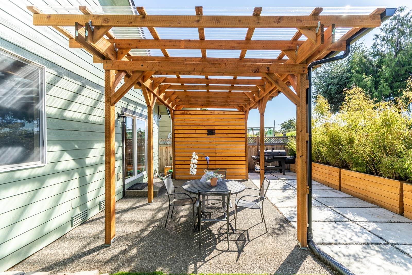 7365 Radius Loop Southeast Lacey, WA 98513 - Photo 9 of 24 a view of a patio with table and chairs and floor to ceiling window