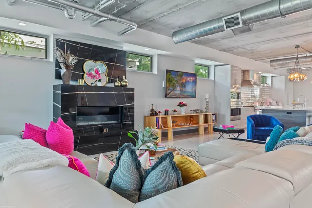 a view of a dining room with furniture and chandelier