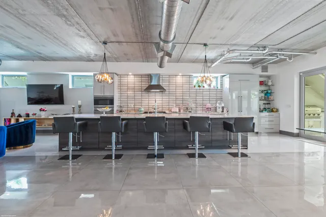 a bathroom with a sink mirror and vanity