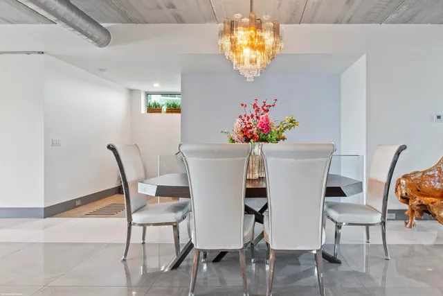 a bedroom with a large bed and a flat tv screen