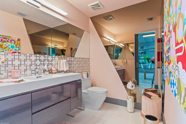 a bedroom with a bed and a table in it