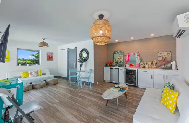a view of a backyard with table and chairs with wooden fence