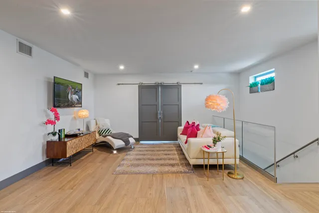 a view of walk in closet with clothes
