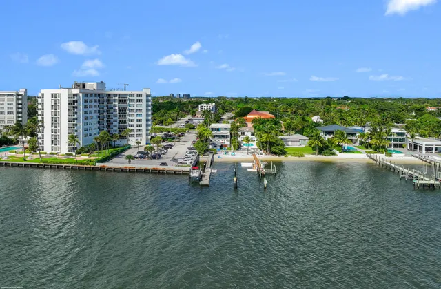 a view of a lake with boats and city view