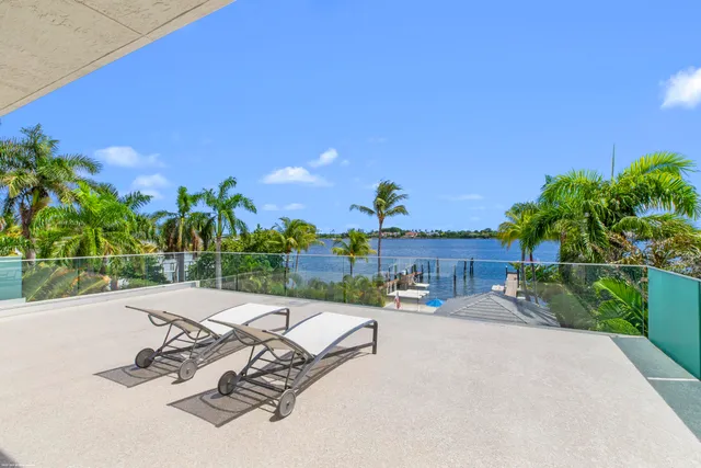a bathroom with a sink mirror and a shower